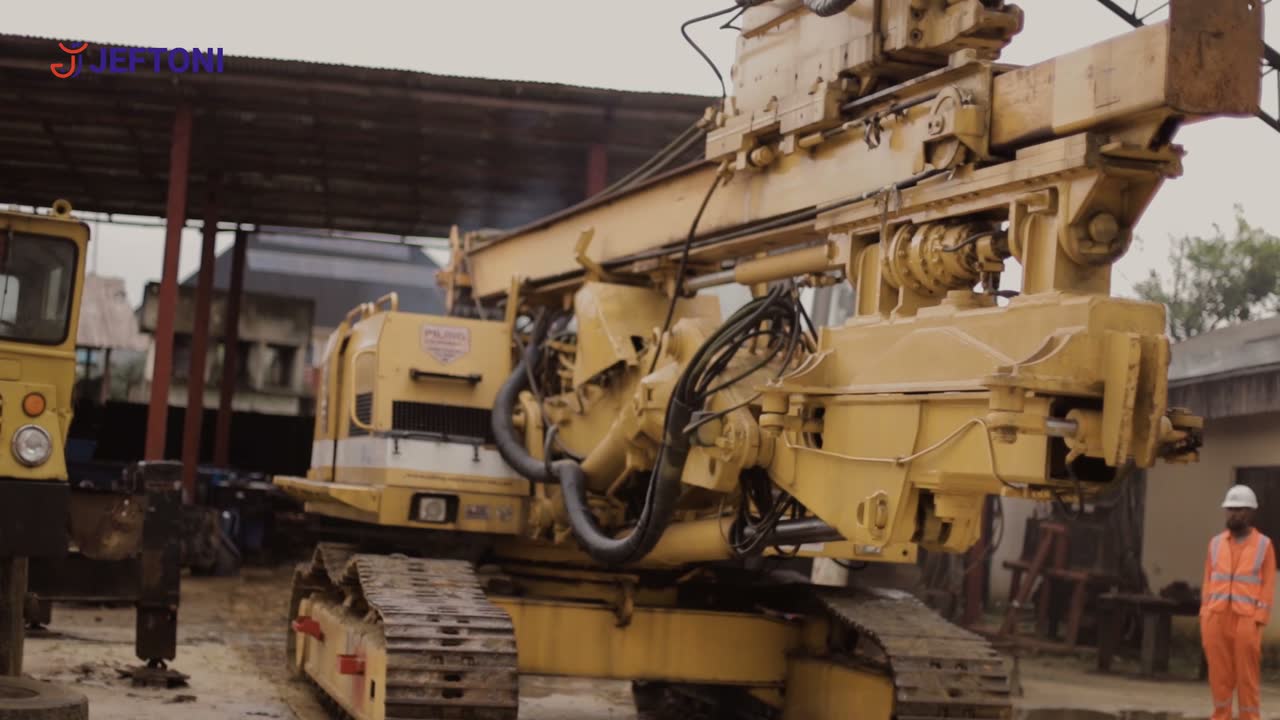 A short film of Jeftoni plant and crews: operators at the controls, rigs under the yard canopy, and engineers reviewing drawings on site